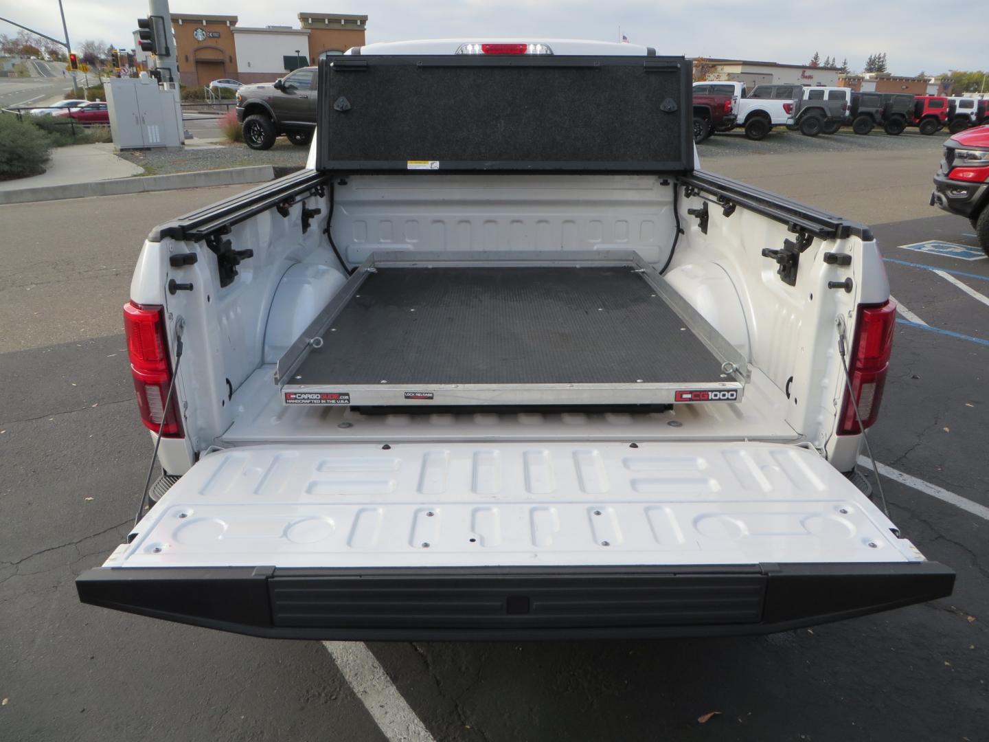 2019 White /BLACK INT W/DARK MARSALA LT Ford F-150 Platinum SuperCrew Cab 4WD (1FTEW1E45KF) with an 3.5L V6 ECOBOOST engine, 10-SPEED AUTO W/TOW MO transmission, located at 2630 Grass Valley Highway, Auburn, CA, 95603, (530) 508-5100, 38.937893, -121.095482 - F150 Platinum featuring a level kit, Fuel Offroad wheels, Toyo AT2 tires, Barricade Front winch bumper, Smittybilt winch, LED light bar, Undercover Ultraflex bedcover, and a Cargo Glide bed system. - Photo#12